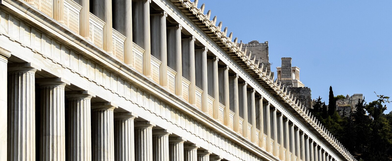 The colonnade of the Stoa of Attalos in the Ancient Agora of Athens, with the Acropolis behind