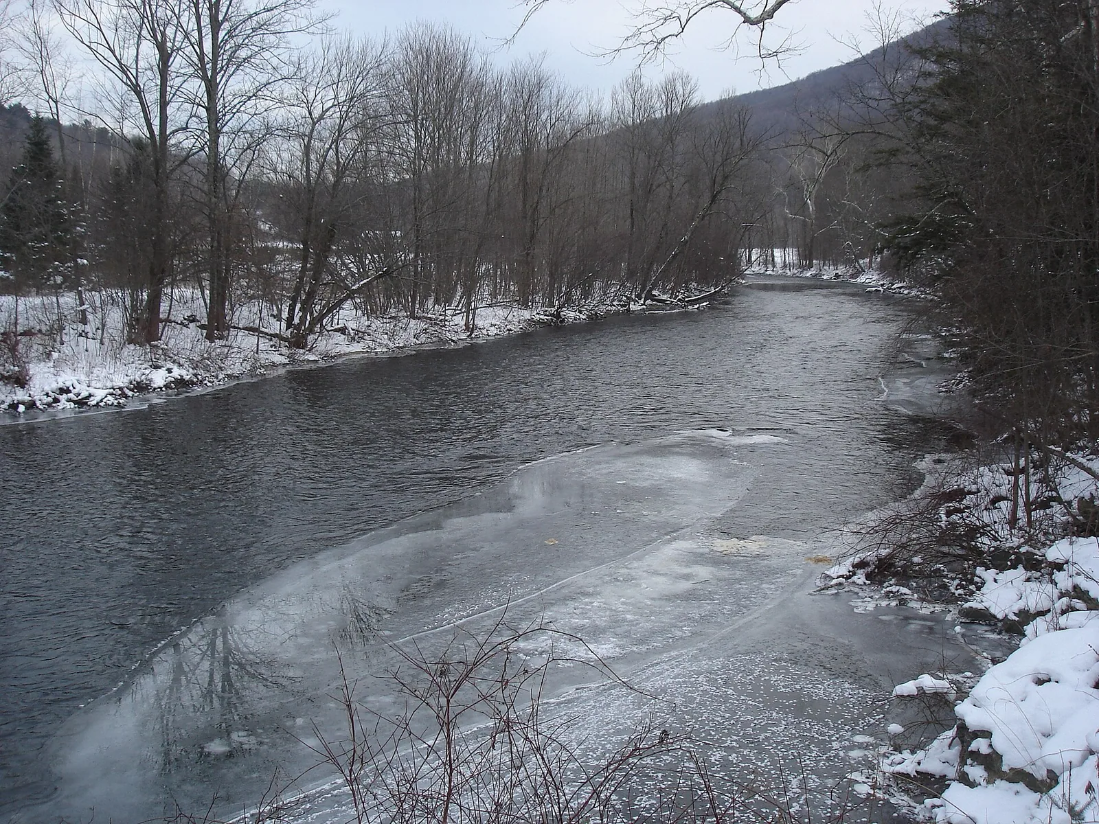 The Battenkill flowing past snow-covered banks in Arlington
