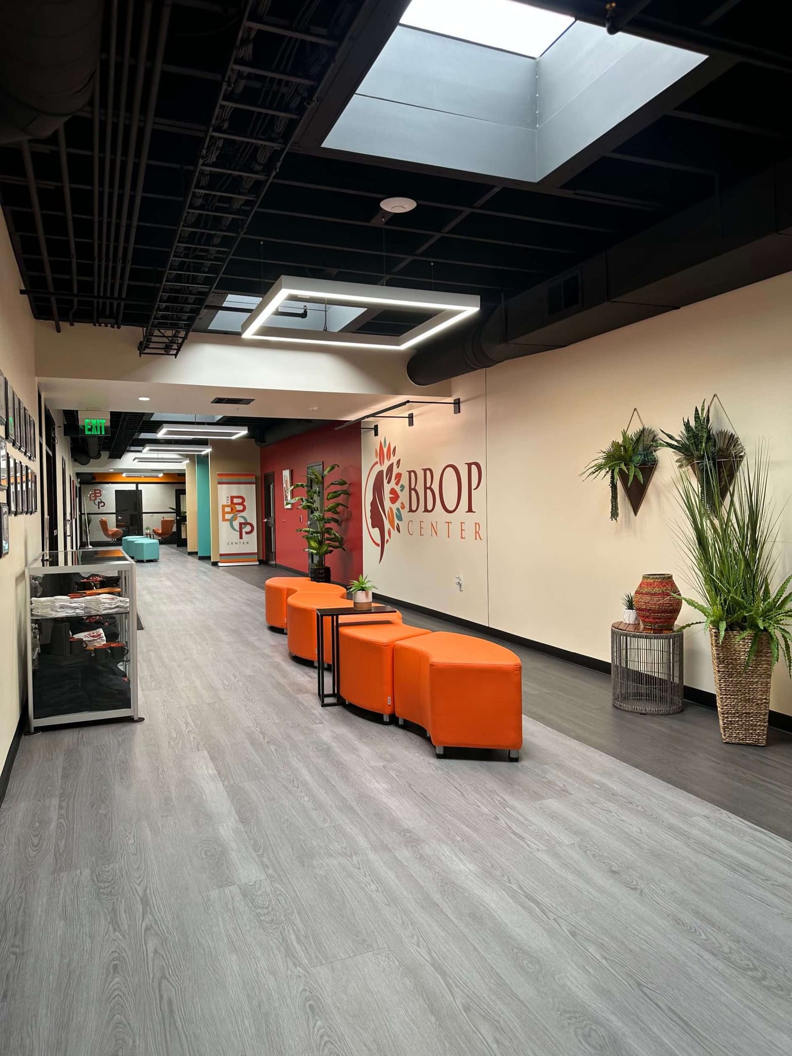 The BBOP Center lobby with its logo wall and orange lounge seating