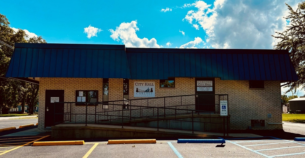 Carlyle City Hall exterior with accessible parking and an entrance ramp.