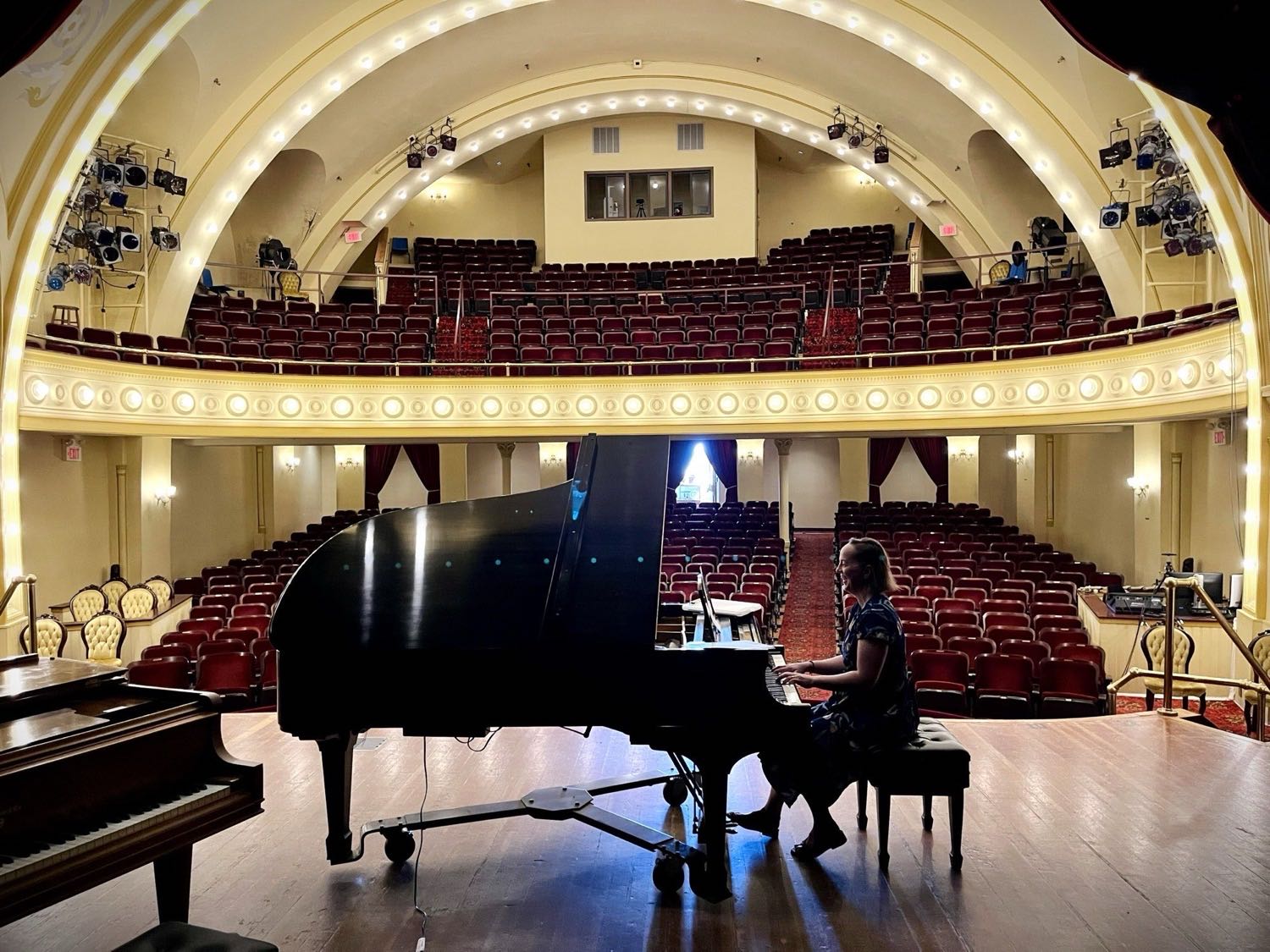 The restored interior of the Cheboygan Opera House, with balcony seating and an ornate stage.