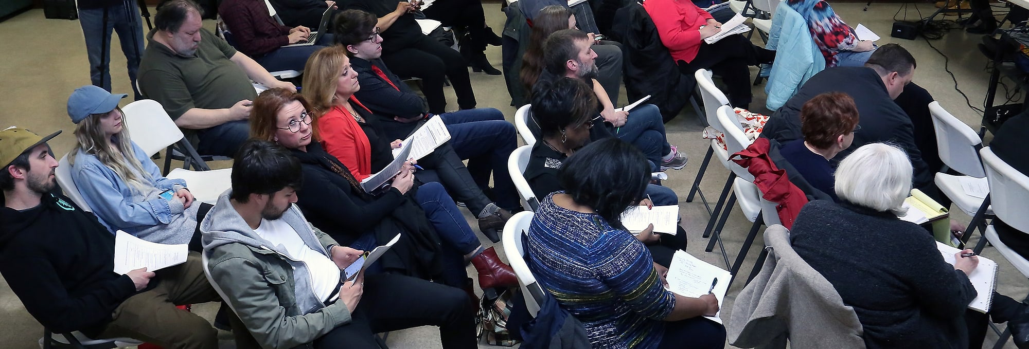 Residents listen during a Community Police Commission public session in Cleveland.