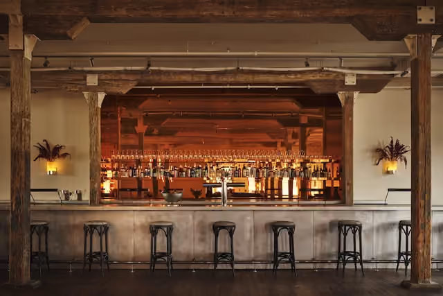 Pocketbook Hudson’s Lounge Bar pairs the building’s industrial architecture with a warm, contemporary design. Credit: Adrian Gaut