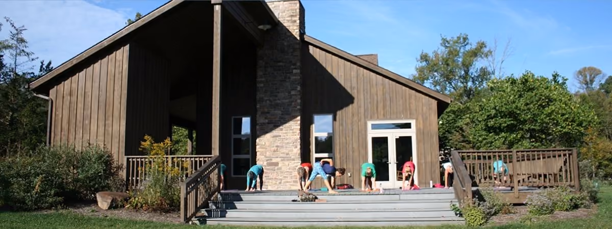 A yoga class on the deck of the Kennard Nature Nook at Grant Park