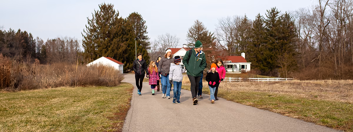 Group walking down a Bill Yeck Park trail