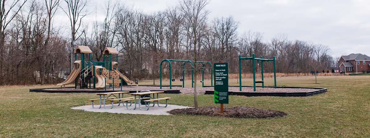 The Weatherstone Park playground, swings and picnic tables