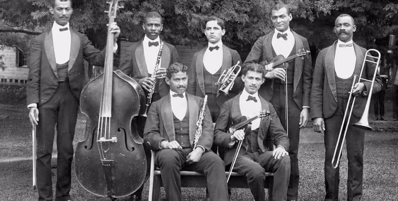 An archival photograph of a Black orchestra from the region’s history