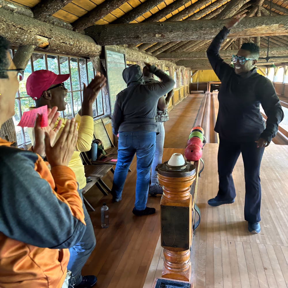 Cheering on the open-air bowling alley