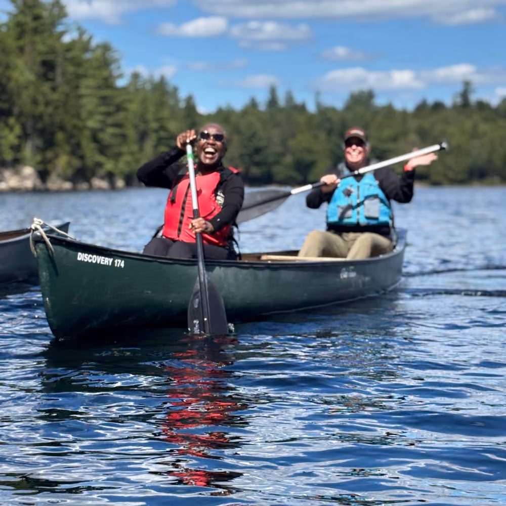 Two paddlers in a canoe on the lake