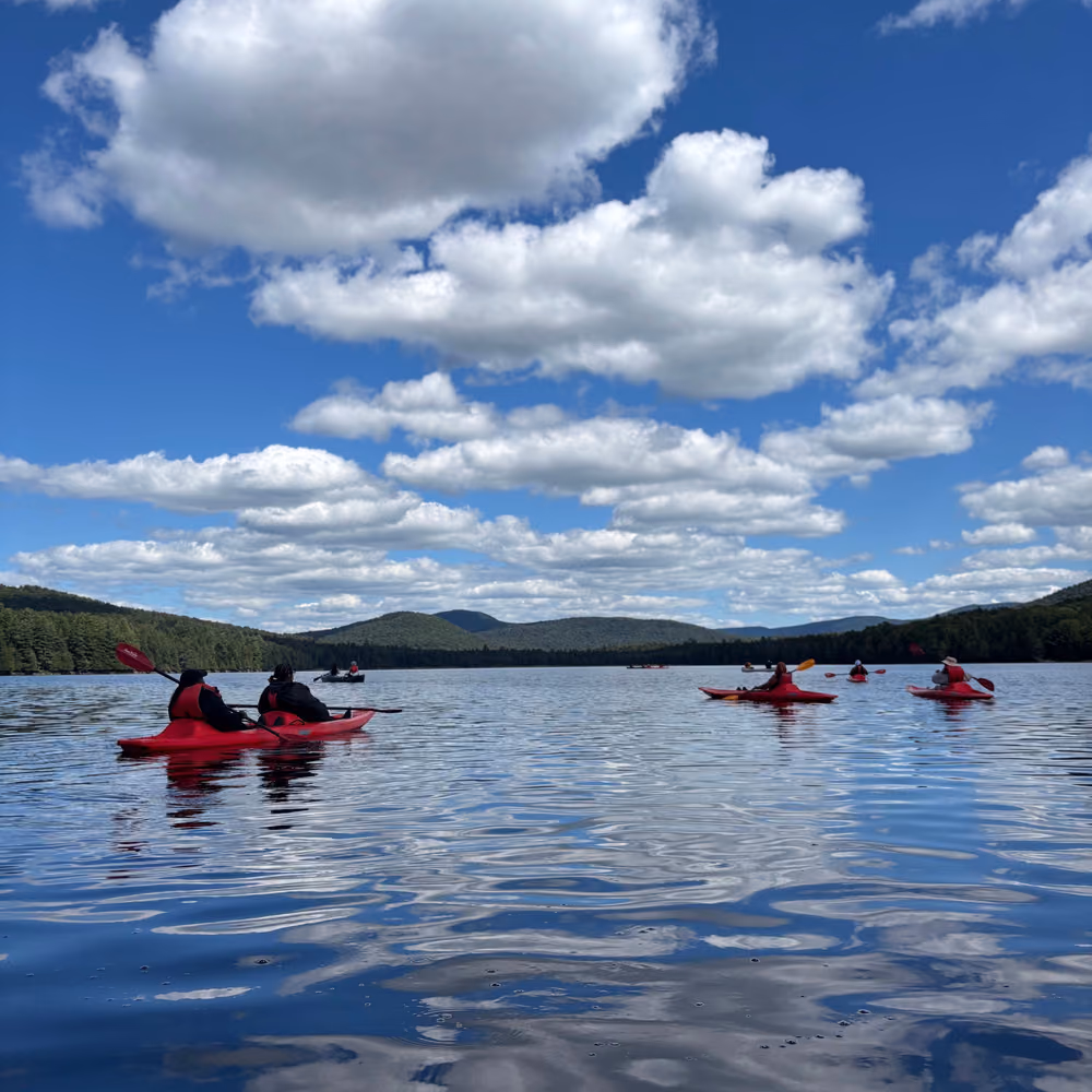 Kayaks on the lake under a big sky