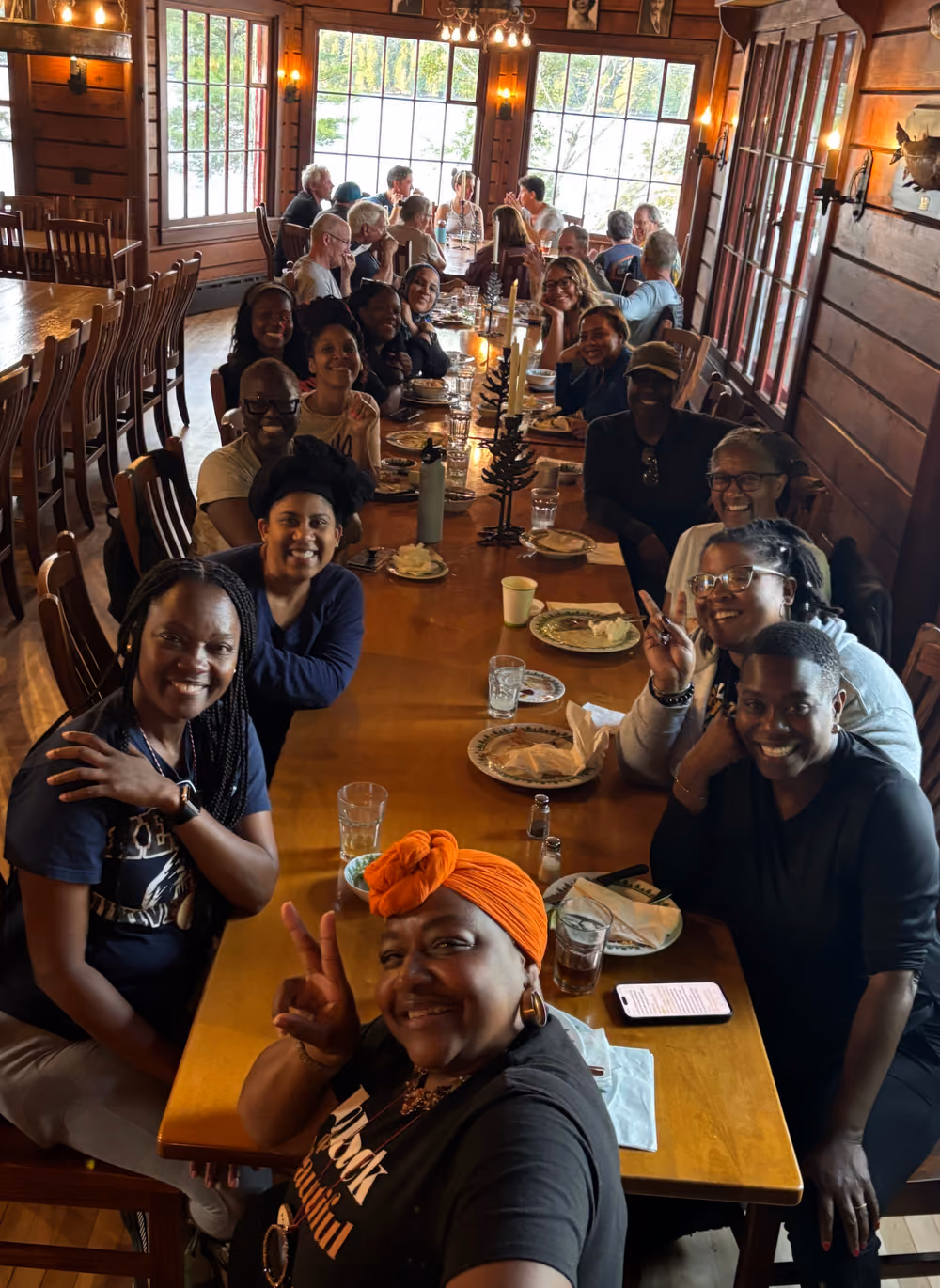 Dinner together at the long table in the dining hall