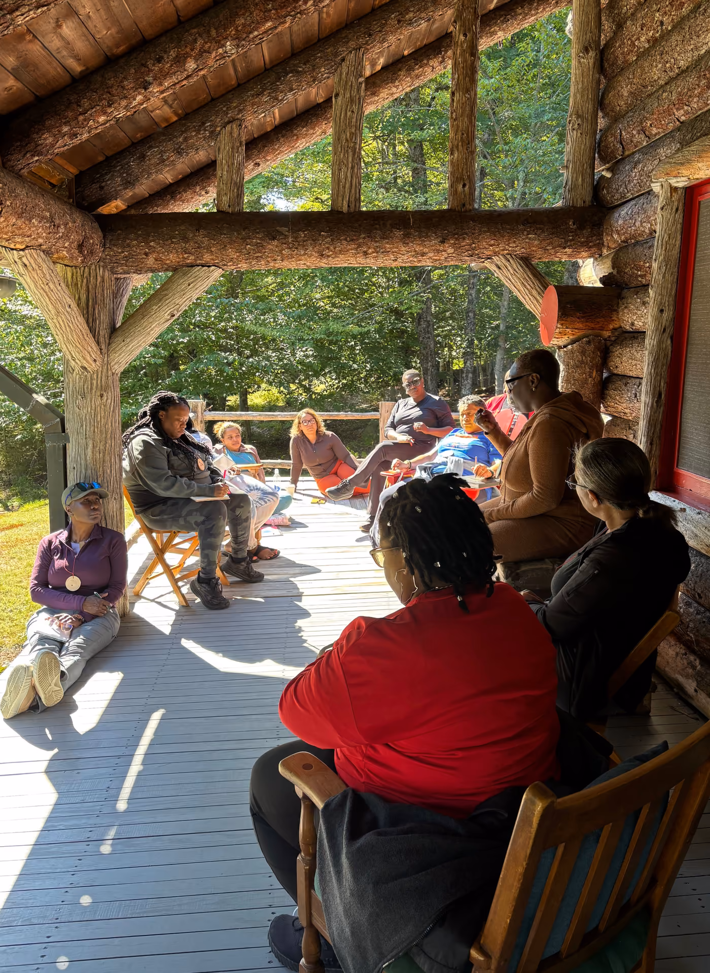 A circle of chairs on the lodge porch