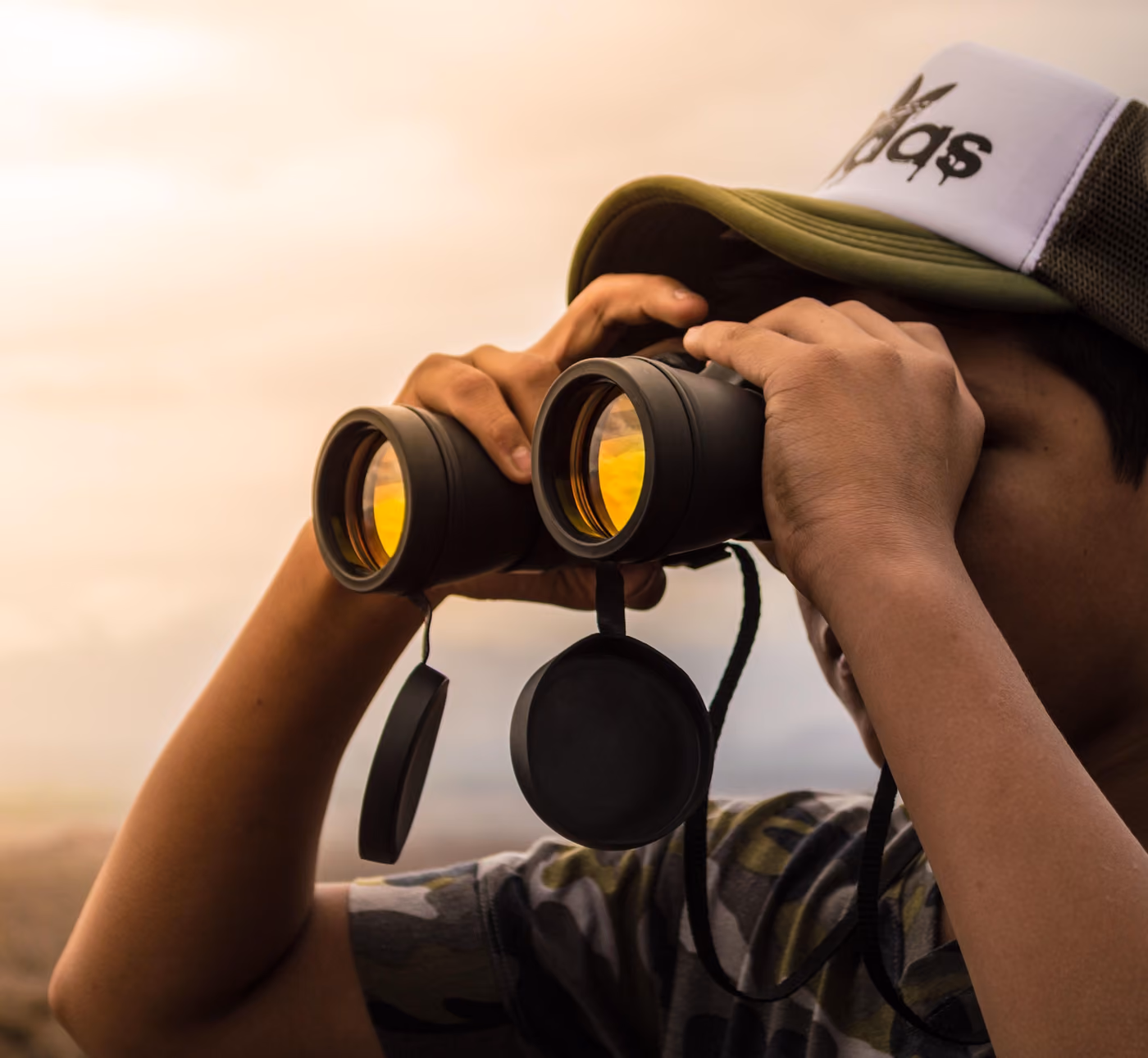 Binoculars raised at the LGBTQIA+ Leaders Retreat