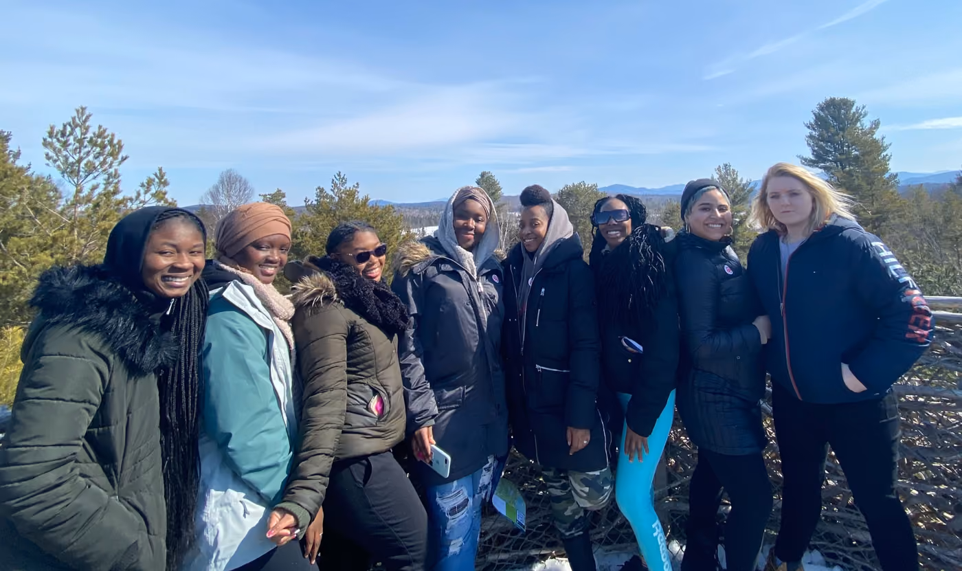 Emerging Stewards participants together at a lookout on a bright winter day
