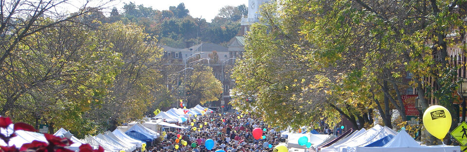 Apple Harvest Day: crowds and white tents down tree-lined Central Avenue in Dover
