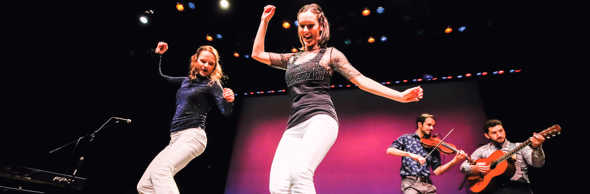 Dancers and guitarists on stage at the Tecumseh Center for the Arts
