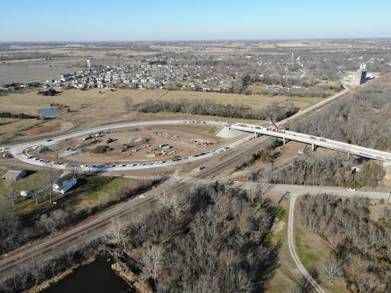 The 207th Street grade separation from the air, a new roadway curving over the rail line.
