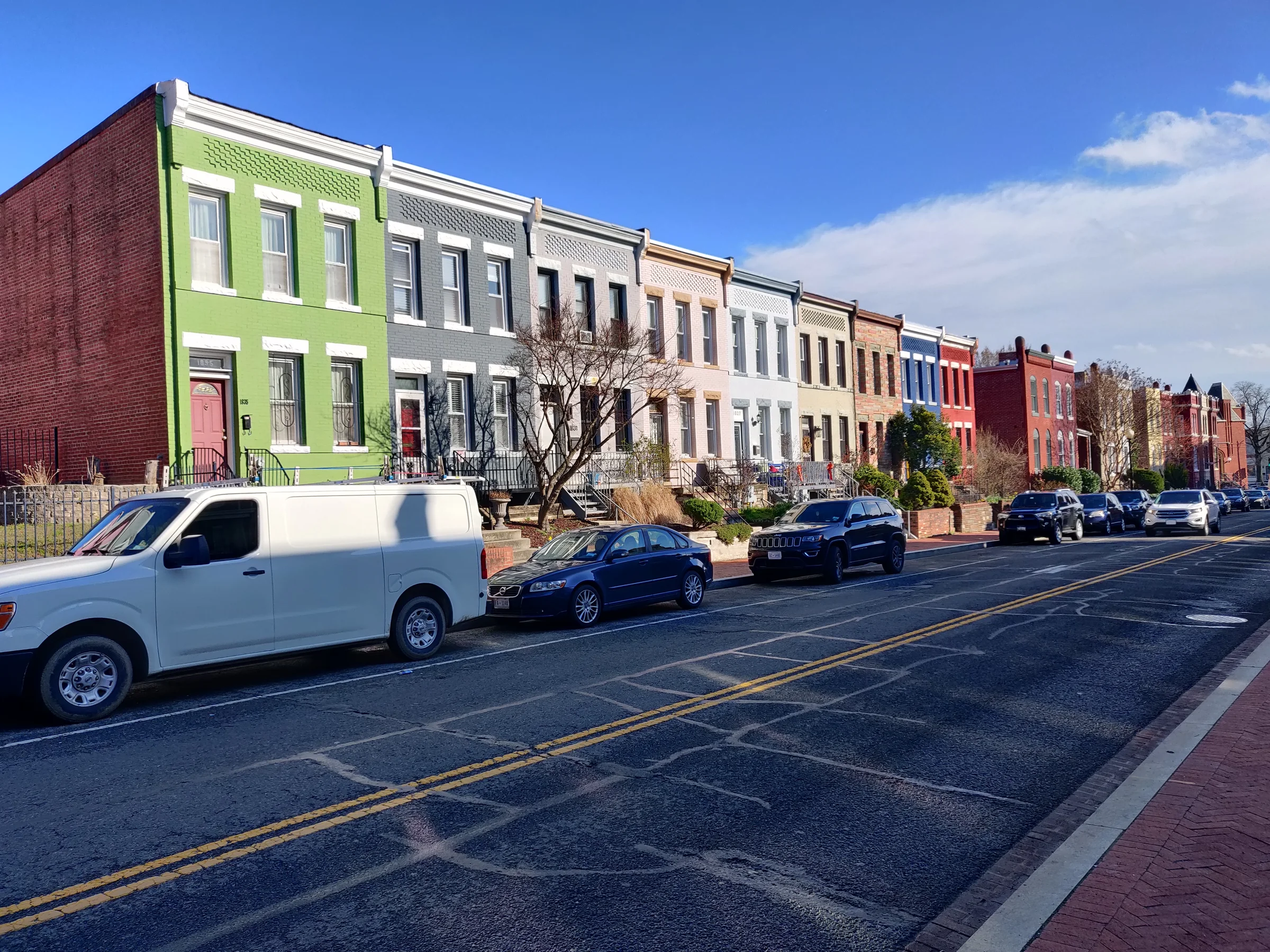 Colorful row houses along a Washington, DC street.