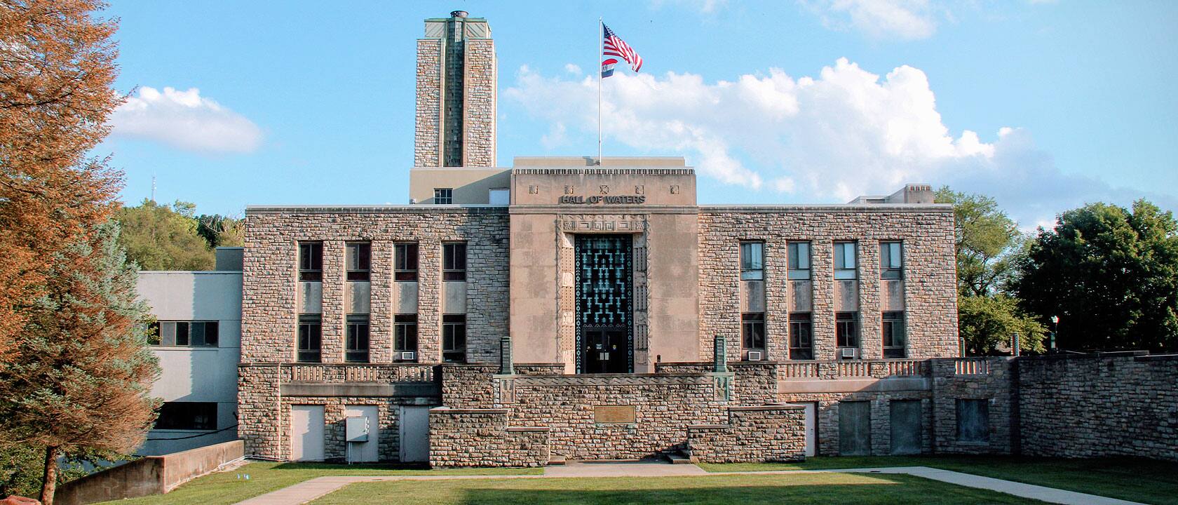 Hall of Waters City Hall in Excelsior Springs, with a stepped limestone facade and teal entrance