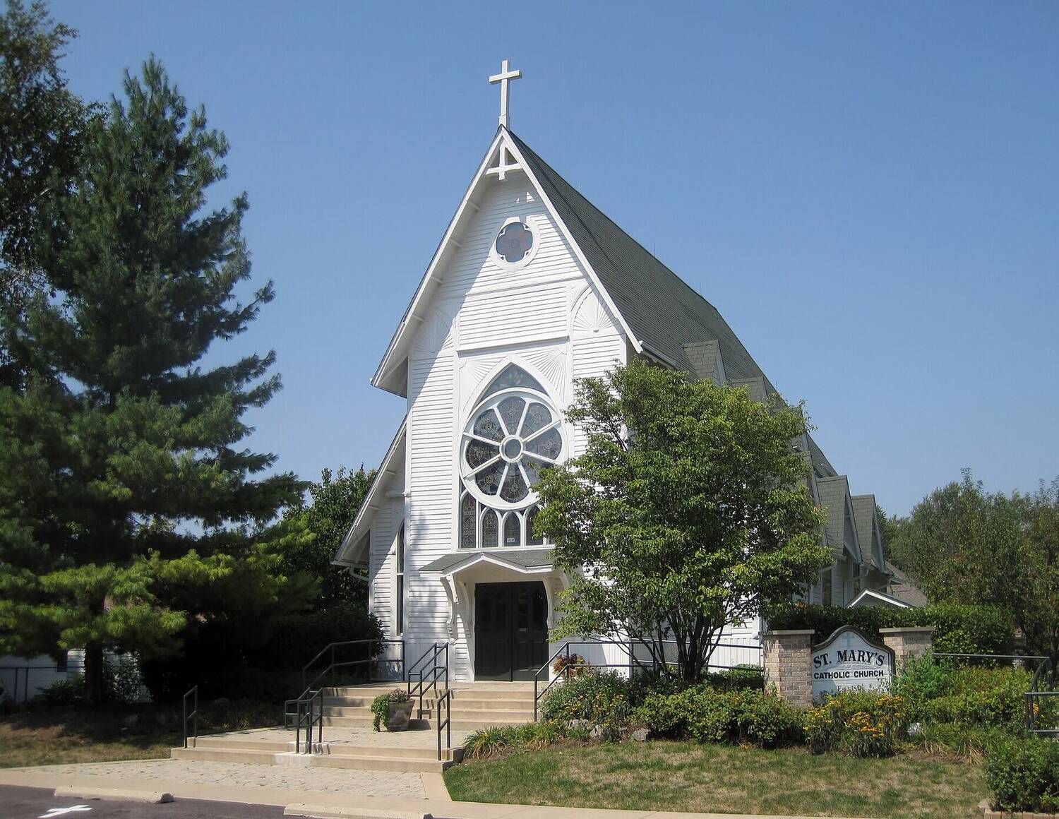 St. Mary's Catholic Church in Gilberts; a white historic church with a steeple.