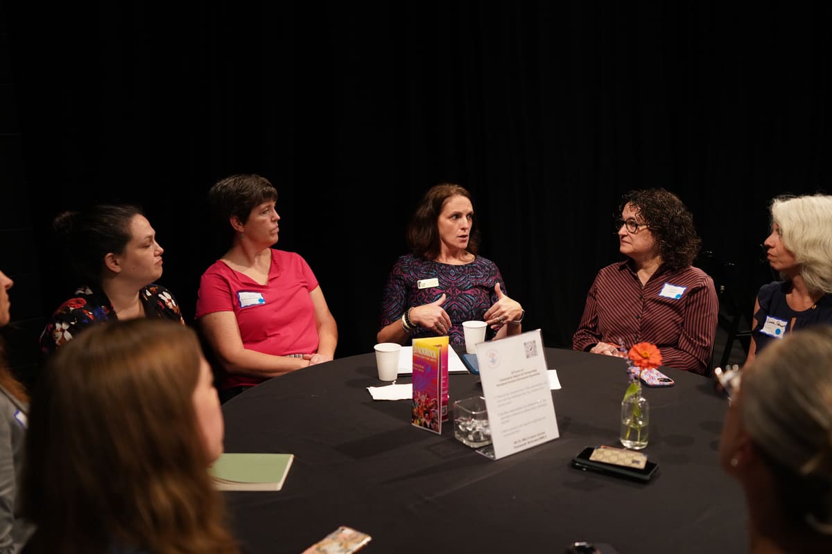 The Youth Behavioral Health breakout: women around a table in conversation