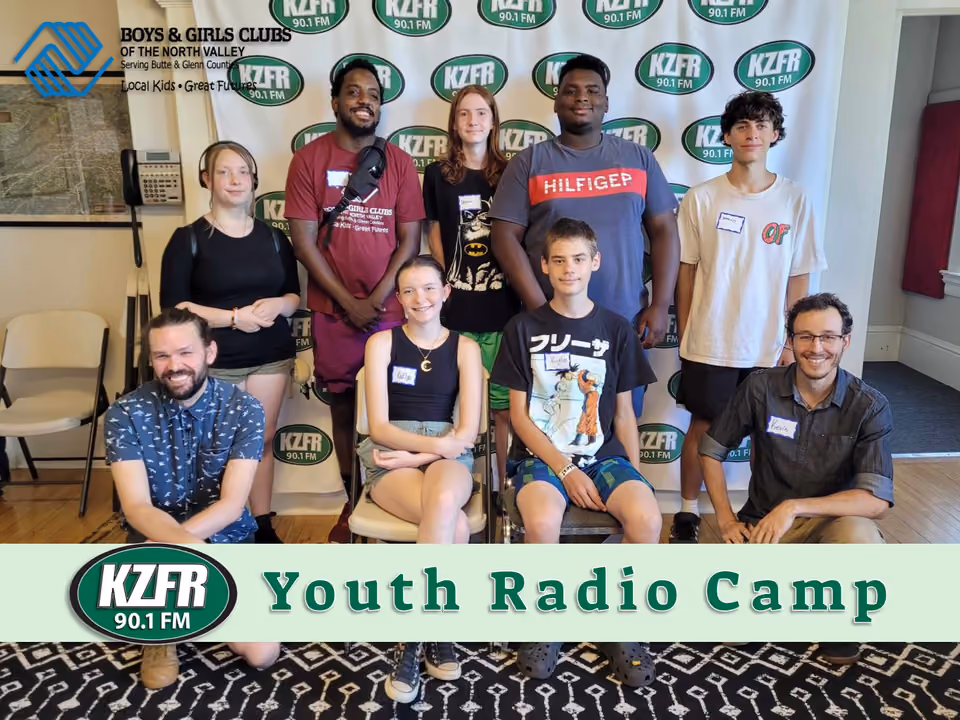 Group photo of Youth Radio Camp participants and two adult instructors posed in front of a KZFR banner, with a Boys & Girls Clubs logo