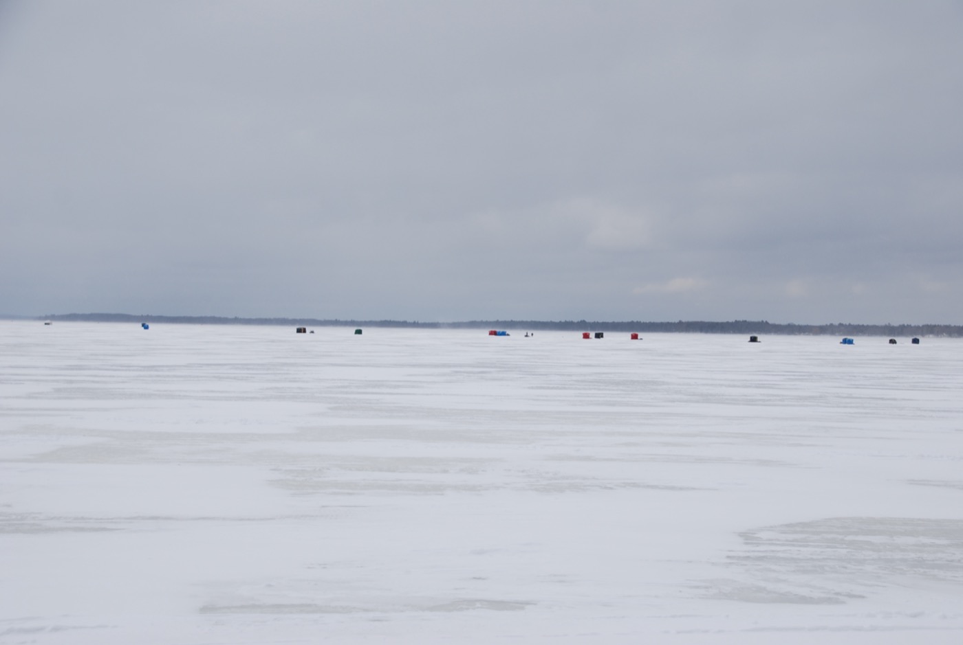 Ice-fishing shanties dotting the frozen surface of Houghton Lake during Tip-Up Town weekend