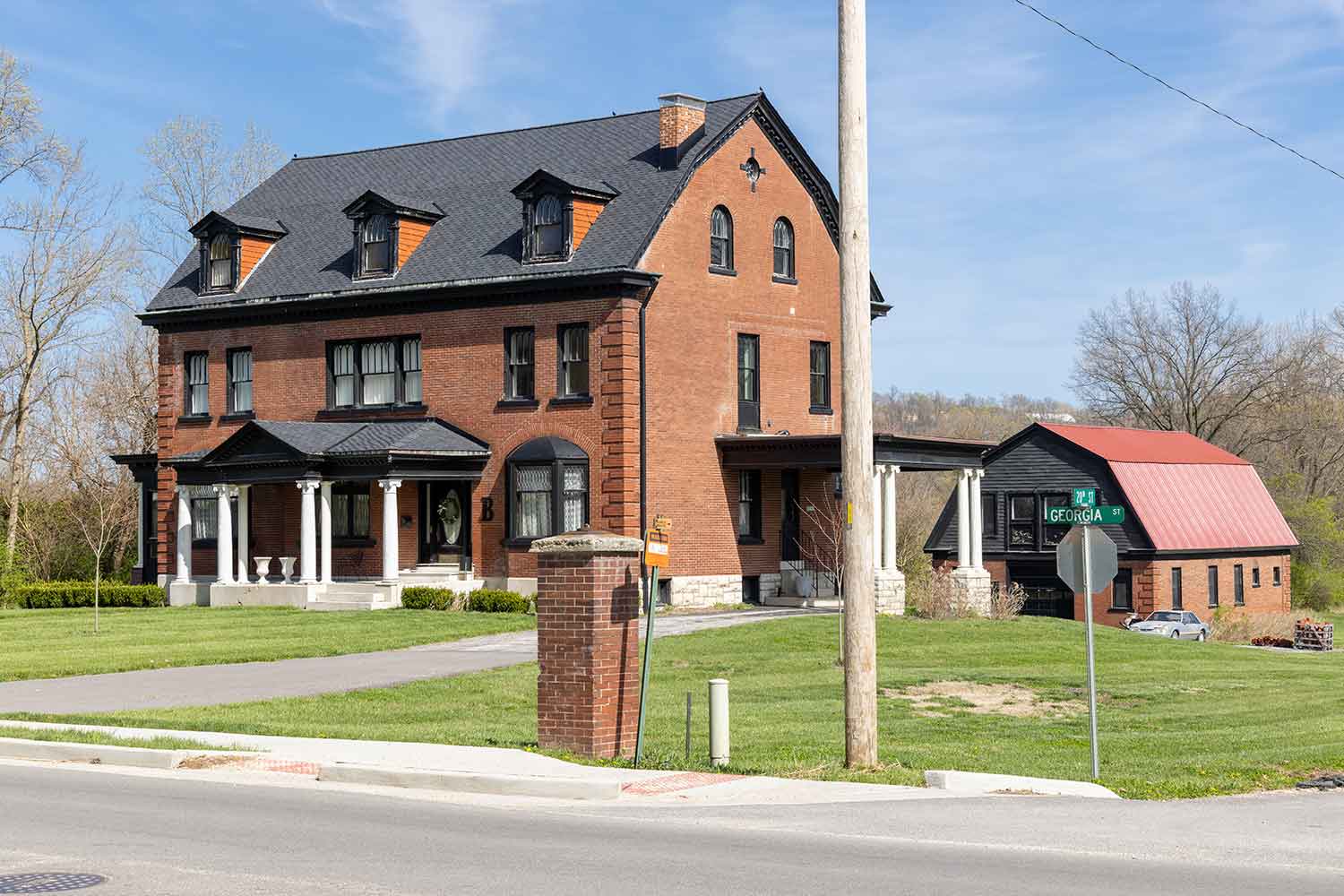 A red-brick Italianate house in one of Louisiana's historic residential neighborhoods.