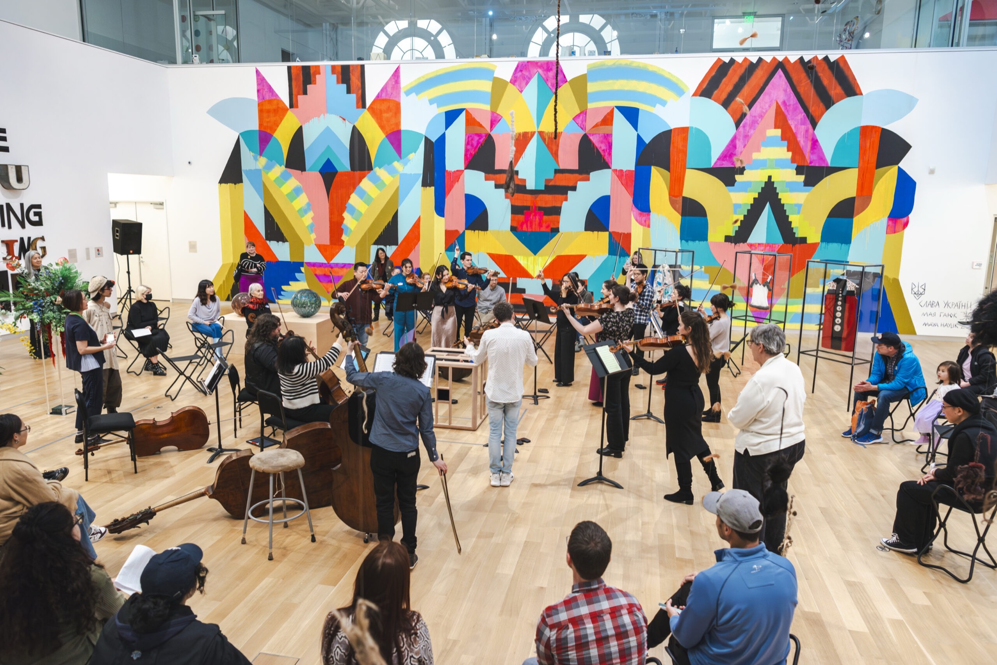 Musicians perform in a MassArt Art Museum gallery.