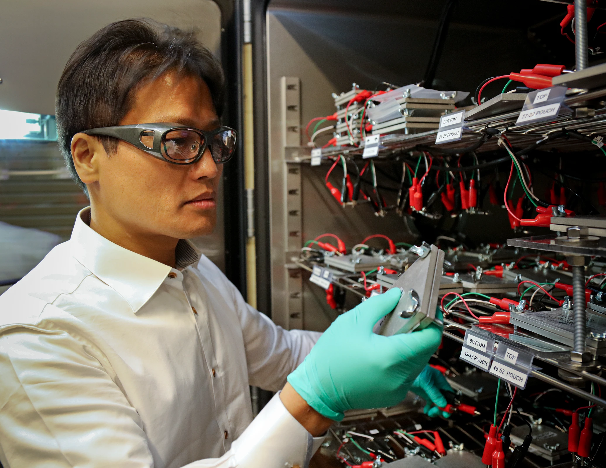 Researcher testing lithium-ion batteries at Oak Ridge National Laboratory