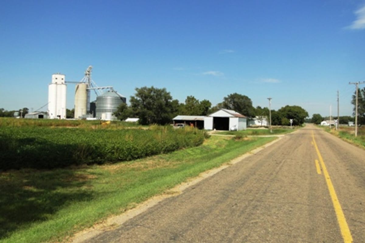 The road into Asherville with the grain elevator ahead