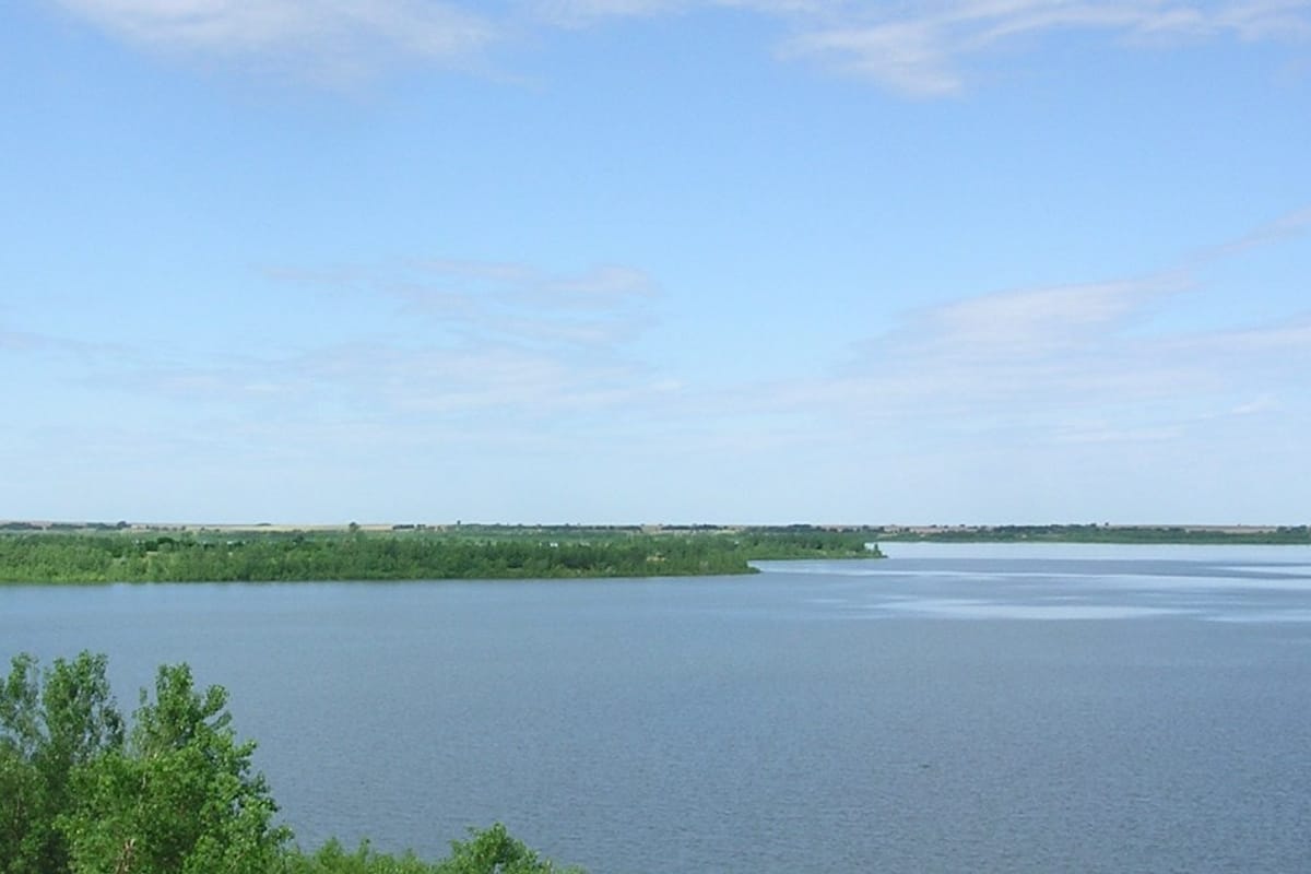Waconda Lake from the shore, blue water to the far bank