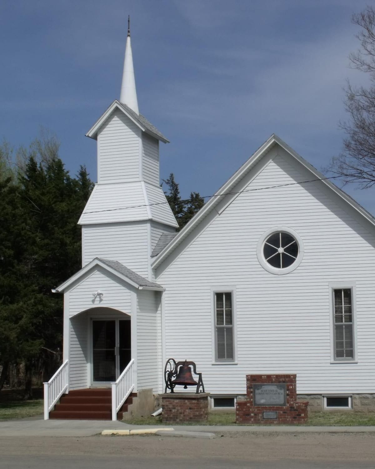 The white steepled church at Scottsville under a sky of small clouds