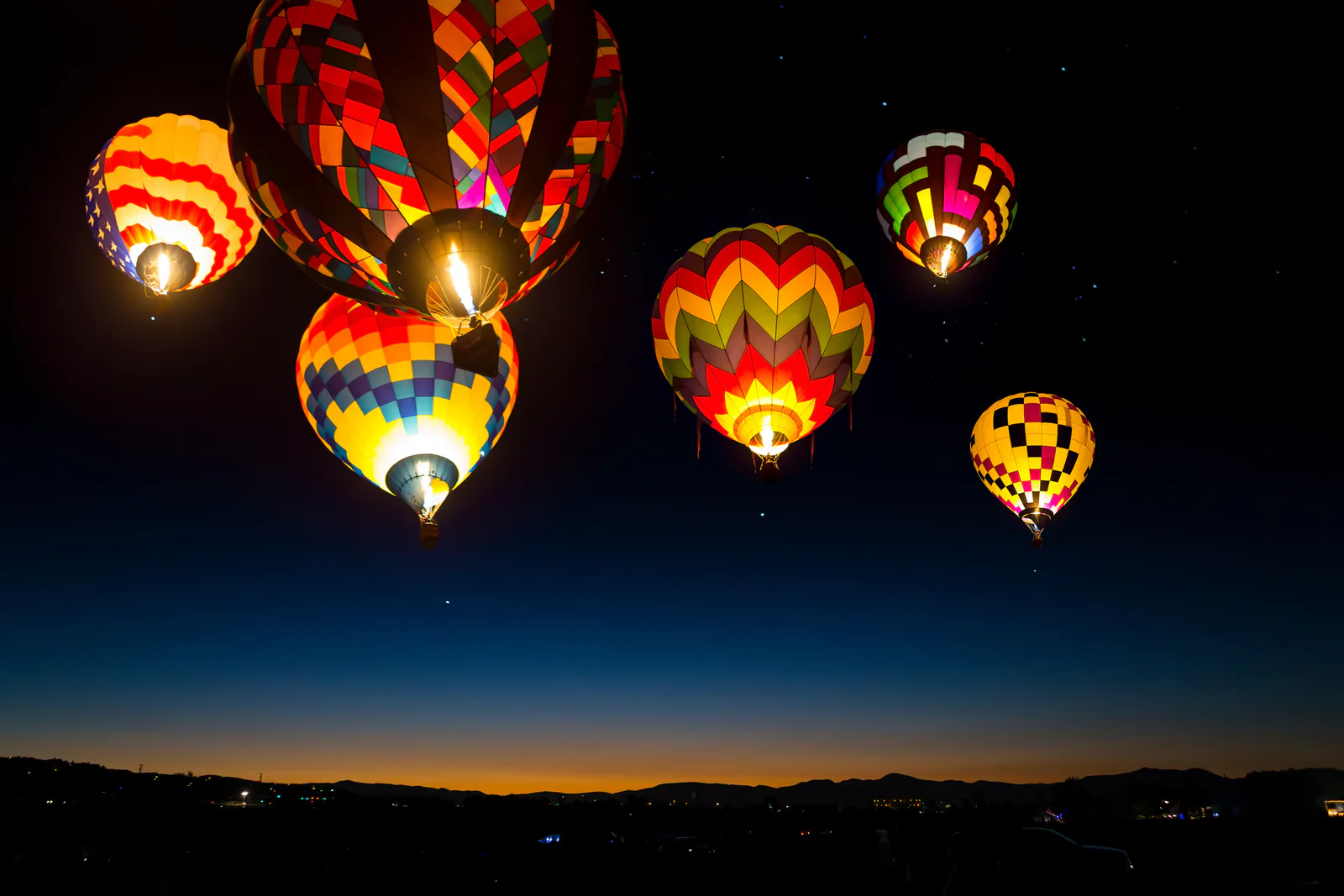 Hot air balloons over New Mexico at night