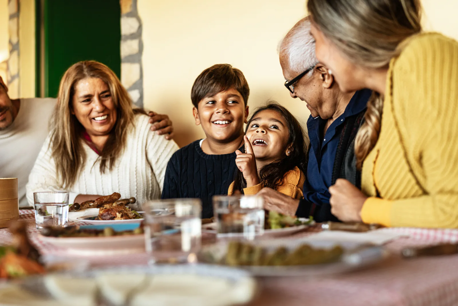 A multigenerational family sharing a meal