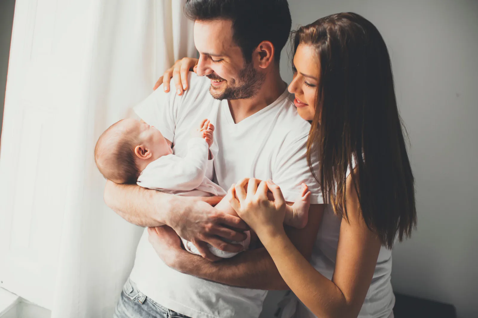 Parents holding a newborn