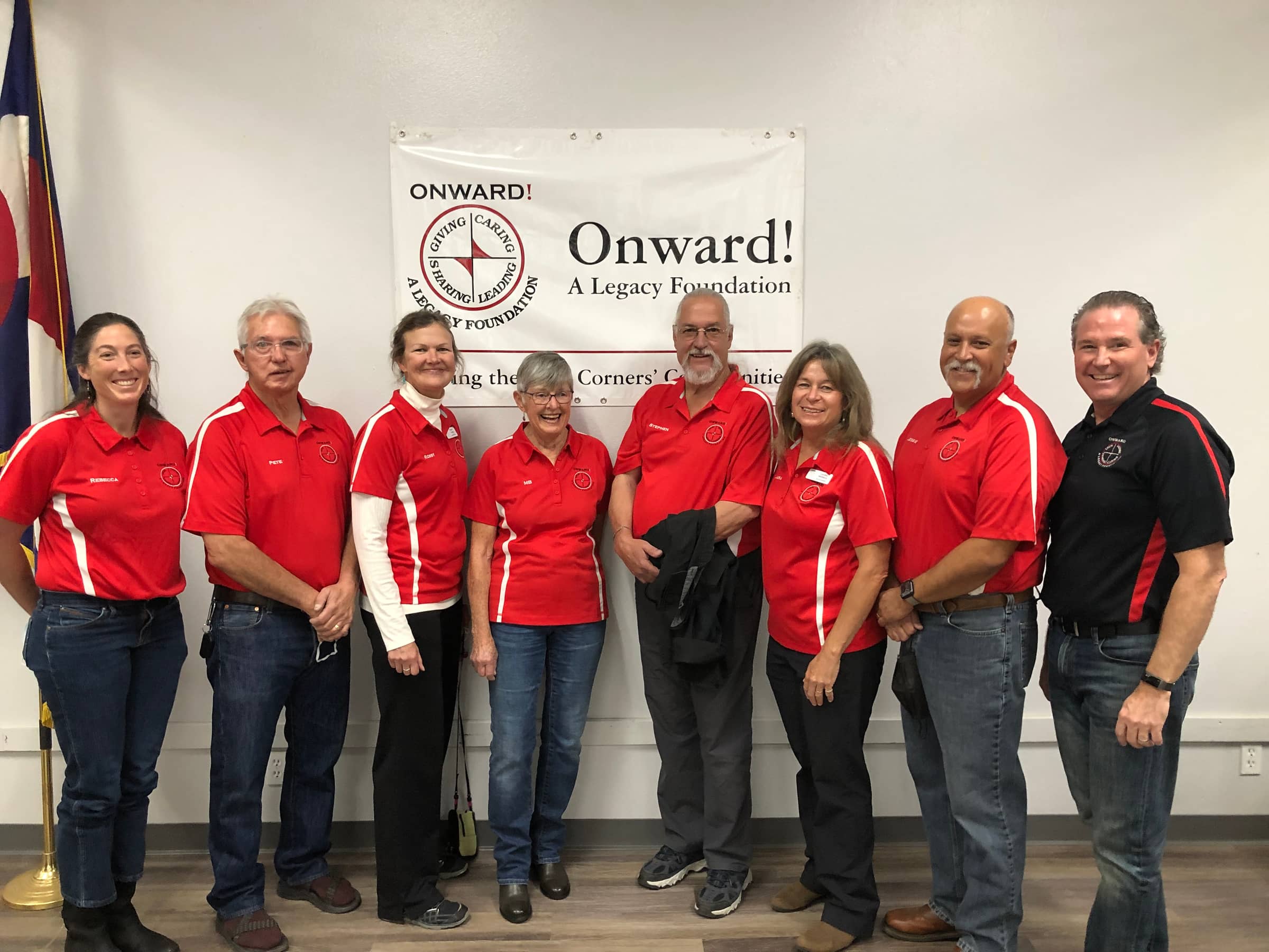 Onward! board members with Executive Director Chuck Forth, in red Onward! polos