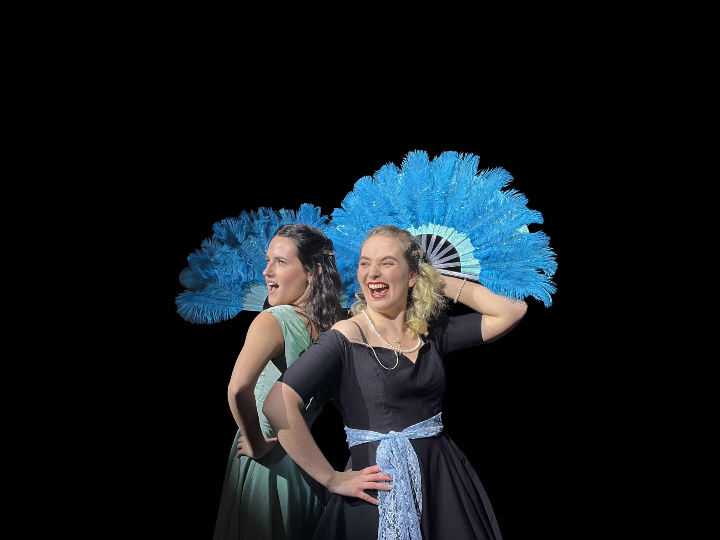 Two performers with blue feather fans in a Lamp Post Creative Learning Center show