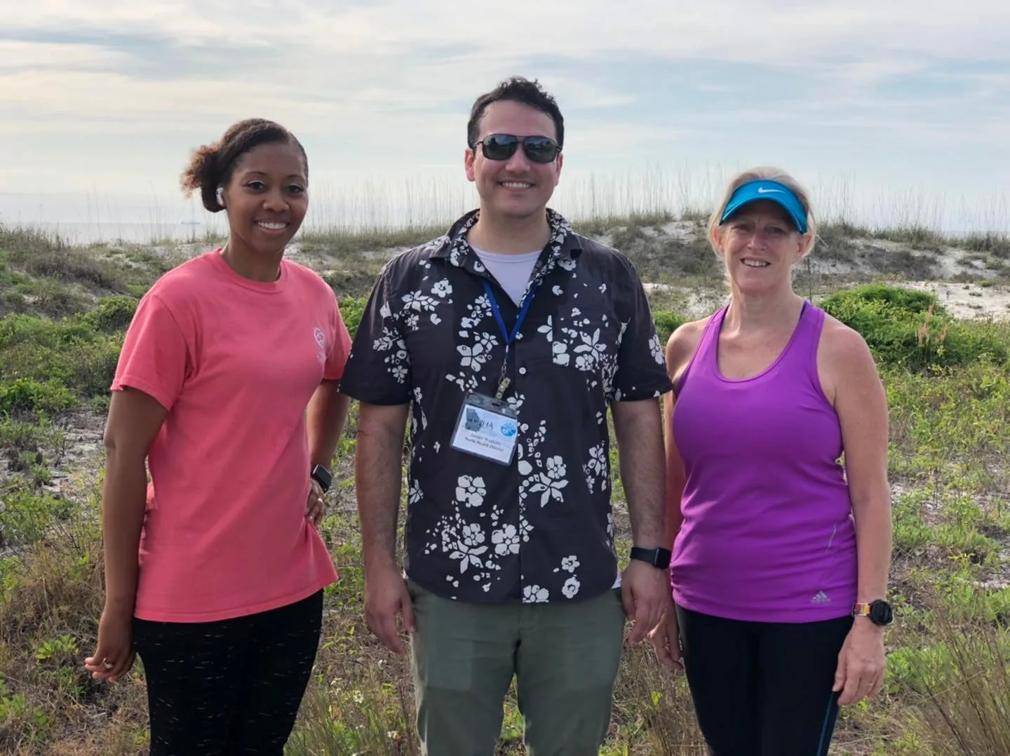 Three District 2 staff members standing together outdoors