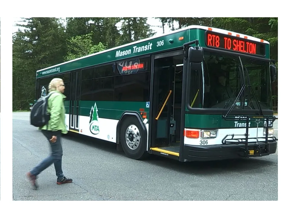 A rider walks toward a Mason Transit bus on Route 8 to Shelton.
