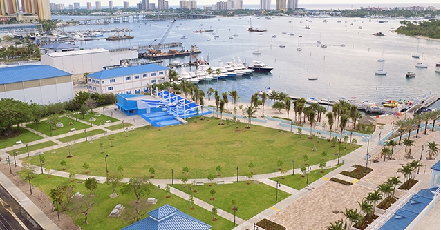 Boats docked at the Riviera Beach city marina with the Intracoastal Waterway and high-rises in the distance.