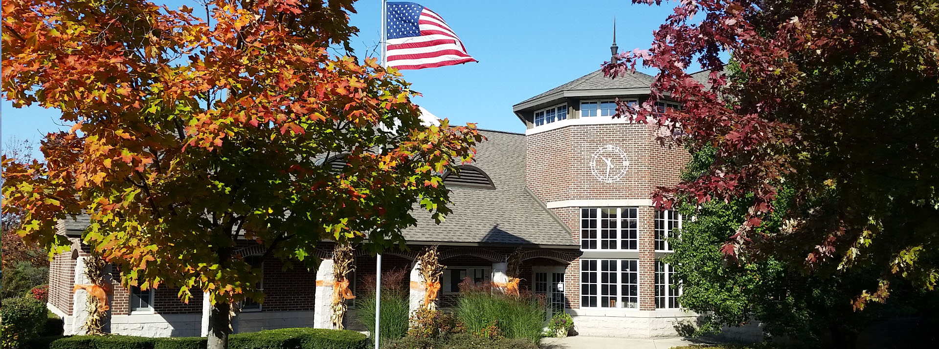 Round Lake Village Hall framed by autumn trees