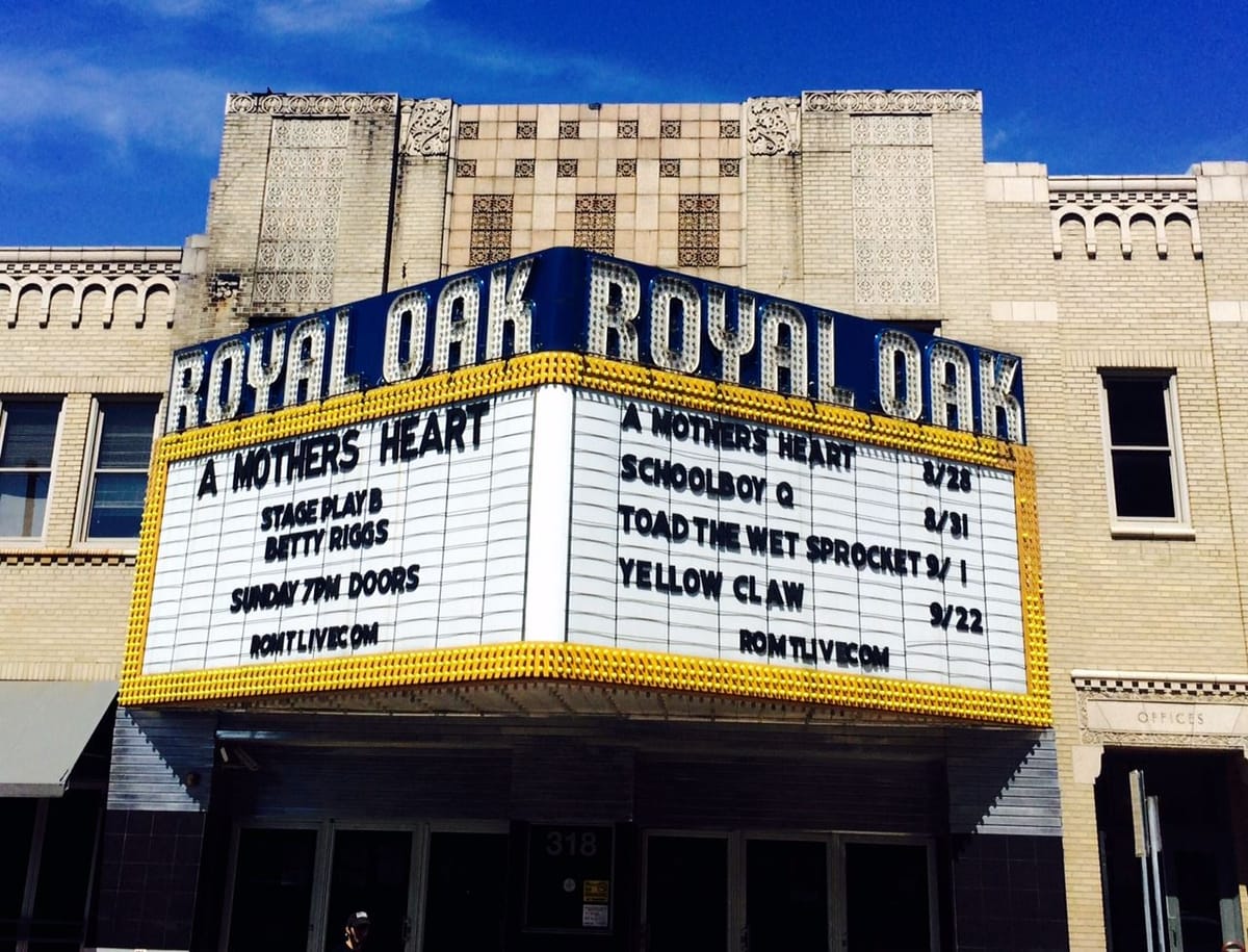 The Royal Oak Music Theatre marquee in daylight, both faces listing the coming shows