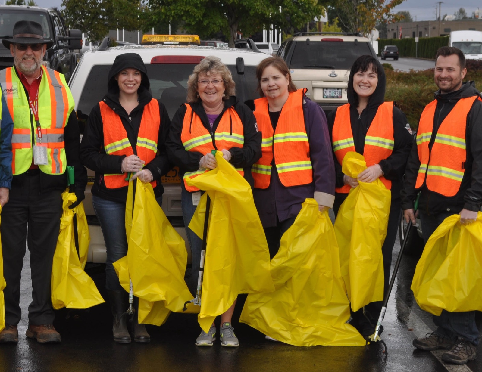 Cherriots staff and Salem neighbors working a community street cleanup together