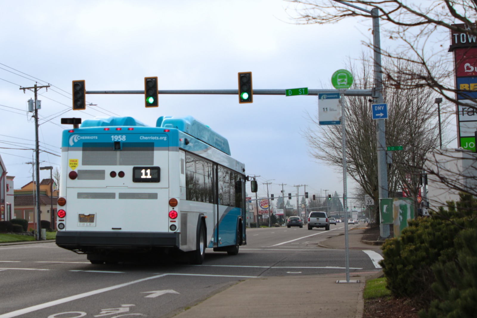 A Route 11 bus at a green light on Lancaster Drive, where signal-priority technology now runs