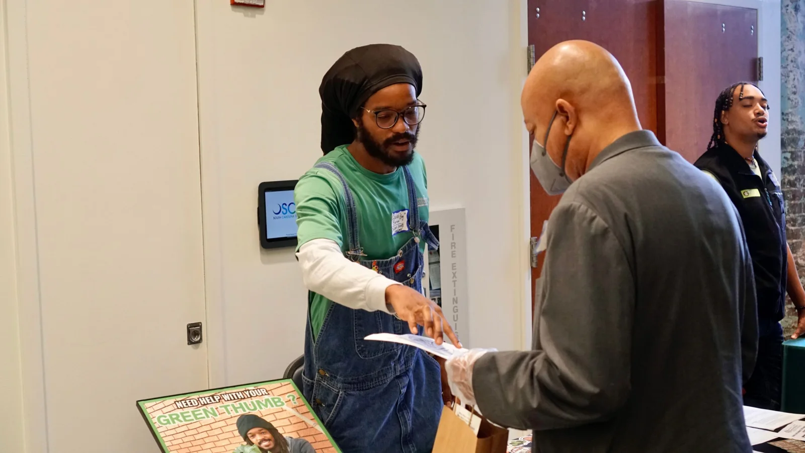 People talk together at a South Carolina Black Farmers Coalition event.