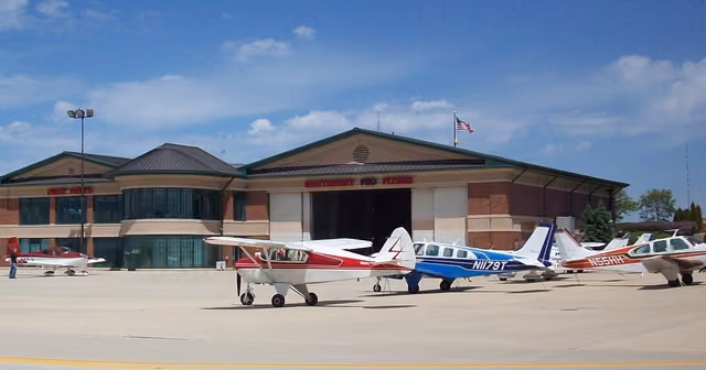 Small planes parked on the apron in front of the Schaumburg Regional Airport terminal