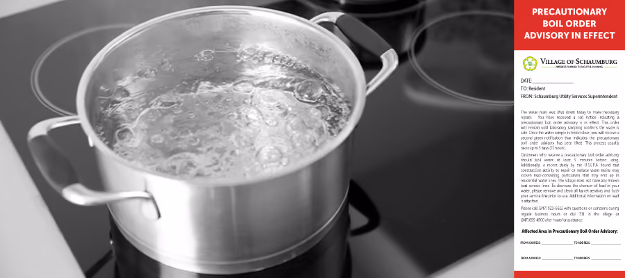 A pot of water boils on an electric stove next to a precautionary boil order notice letter