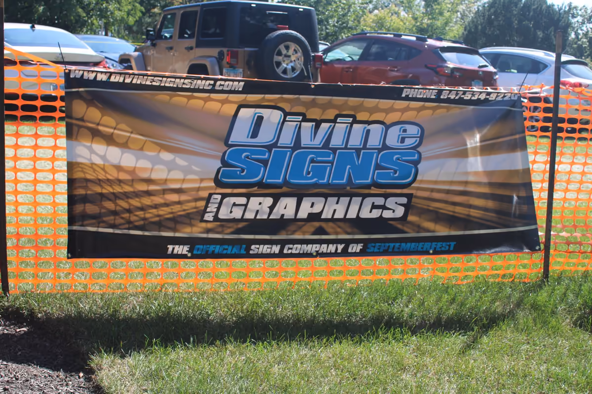 A sponsor's banner on the fence at Septemberfest