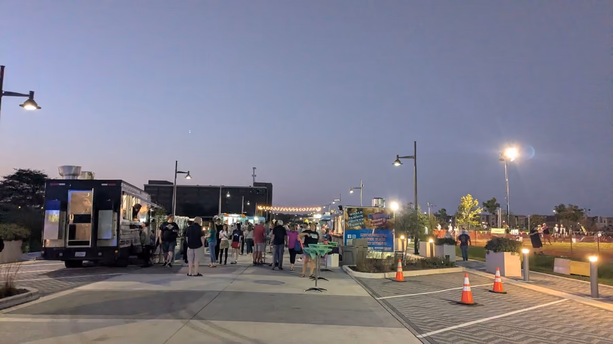 Food trucks along Promenade Drive at dusk